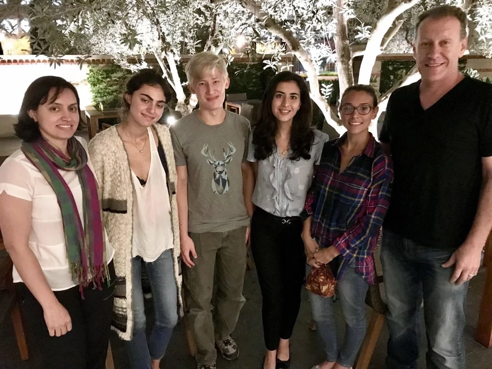 A group of students and Dr. Bitan pose for a picture during an outing.